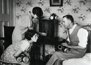 World War Two, England, 1938, The family at home, tuning in to hear the news on the radio news, They have gas masks at the ready  (Photo by Popperfoto/Getty Images)